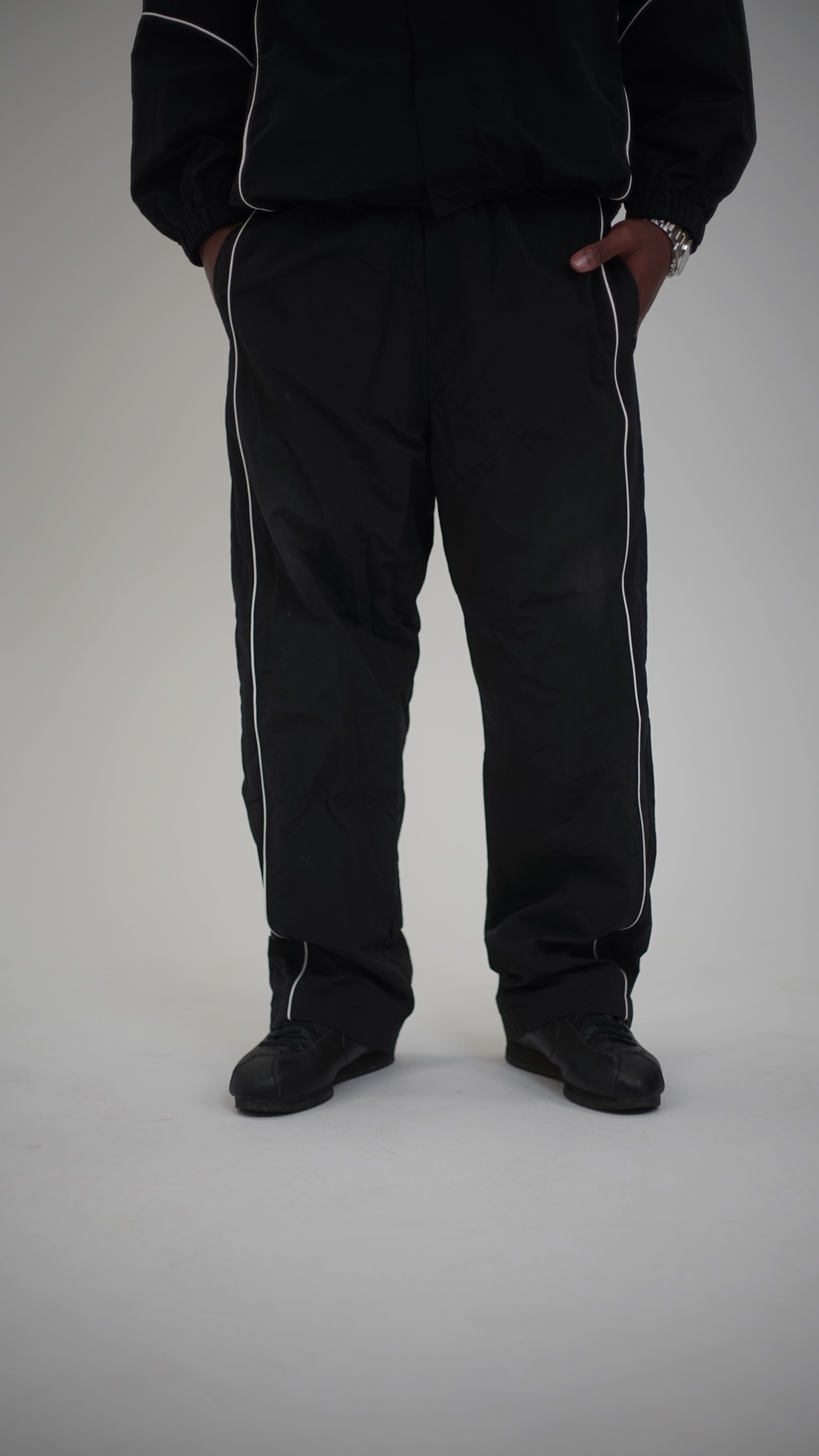 Track pants comment, Men & women - Black and white